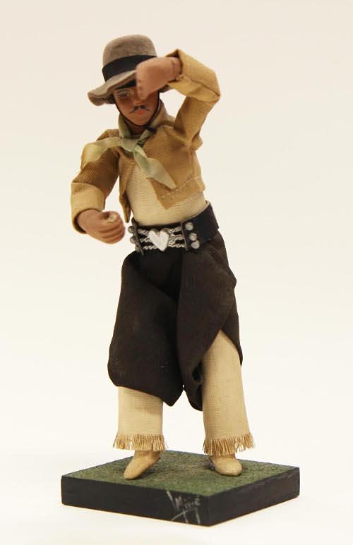 Two doll figures, dancing