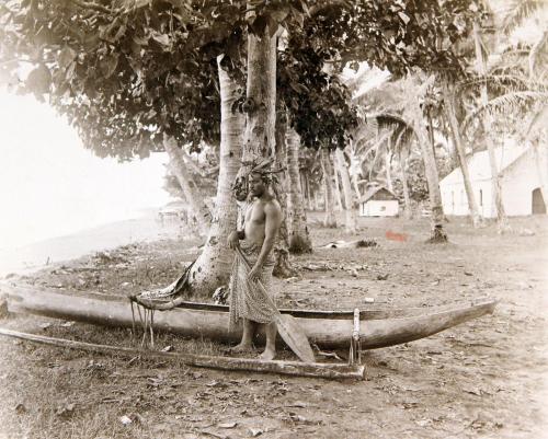 Man with outrigger canoe