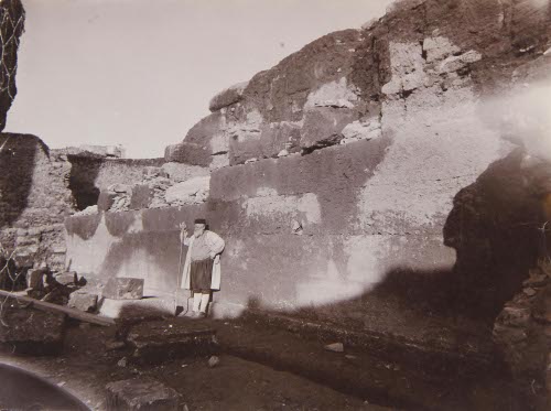 [Man standing in ruins]