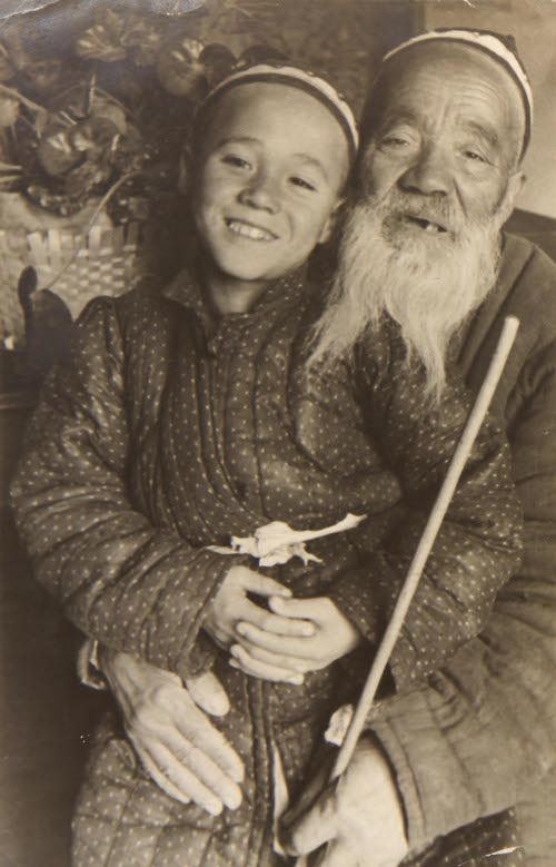 Portrait of Elderly Man with Child