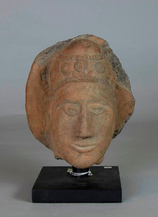 HEAD OF A CROWNED HINDU DEITY