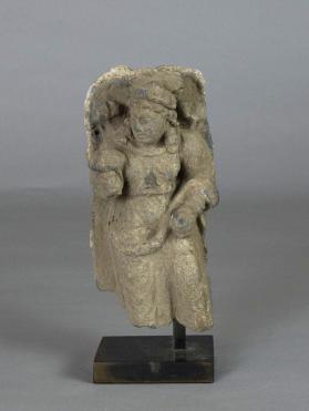 Attendant female figure with flower