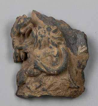 Laocoon fragment with male figure fighting serpent