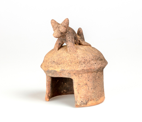 Model House with Dog on Roof