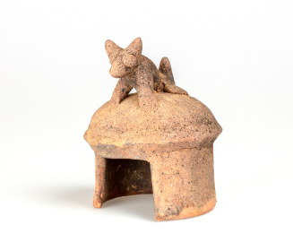 Model House with Dog on Roof