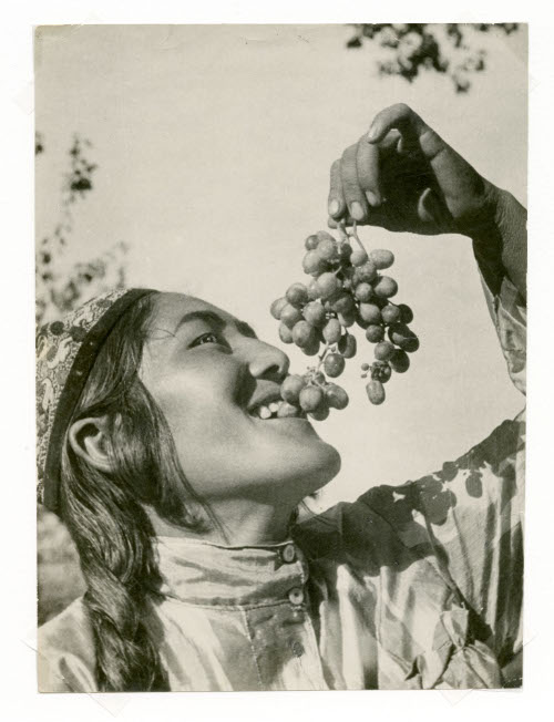 Portrait of Man Eating Grapes