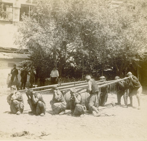 Men Carrying a Barrel on Poles 293