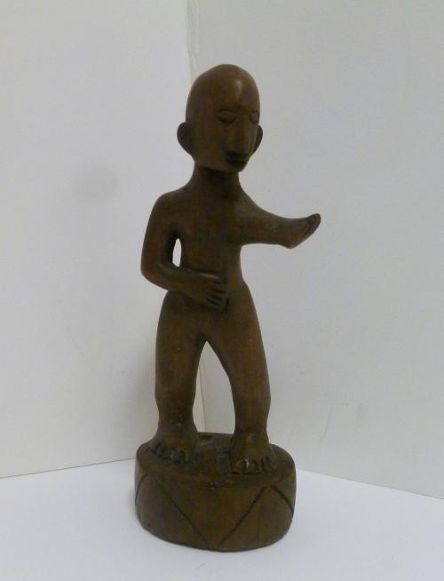 Figurine with outstretched arm