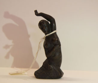 Nude rising from a rock